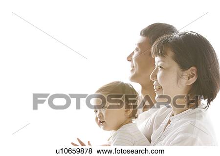 Stock Photo - Side View of Family of Three. Fotosearch