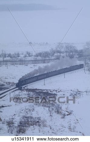 Steam train in winter landscape View Large Photo Image Stock Image - Steam train in winter landscape. Fotosearch