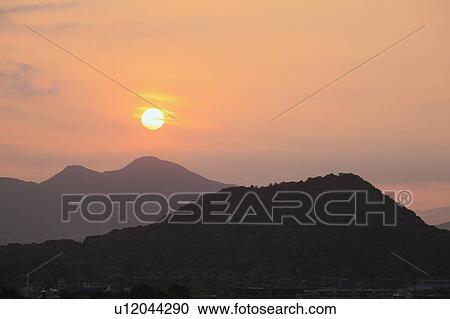 Stock Image - Sunset Over Mountains. Fotosearch