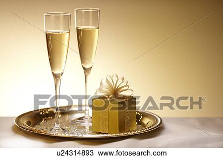 Stock Image - Two Champagnes and Present. Fotosearch