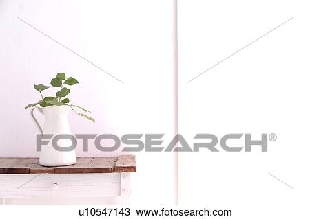 Stock Image - Vase on side table. Fotosearch