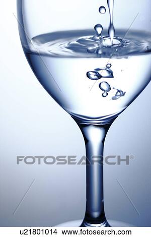 Picture - Water Being Poured Into Glass. Fotosearch