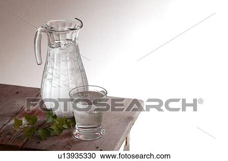 Water in pitcher on side table View Large Photo Image Stock Image - Water in pitcher on side table. Fotosearch