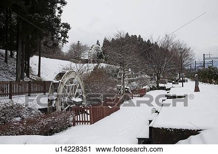 Stock Image - Watermills at Nikko Suginamiki Park. Fotosearch