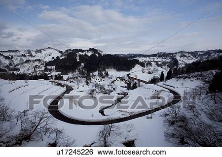 Stock Photograph - Winding Road in Winter Landscape. Fotosearch
