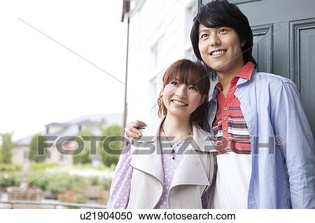 Young couple looking away View Large Photo Image Stock Image - Young couple looking away. Fotosearch