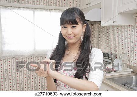 Young Woman Cooking View Large Photo Image Stock Image - Young Woman Cooking. Fotosearch