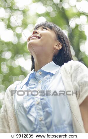 Stock Photography - Young Woman Enjoying Nature. Fotosearch