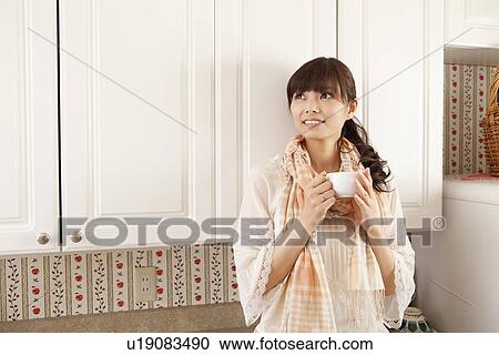 Young Woman Having Tea in Kitchen View Large Photo Image Stock Image - Young Woman Having Tea in Kitchen. Fotosearch