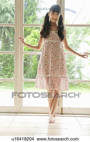 Young Woman in Floral Dress View Large Photo Image Picture - Young Woman in Floral Dress. Fotosearch