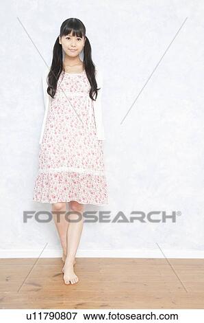 Young Woman in Floral Dress View Large Photo Image Stock Photo - Young Woman in Floral Dress. Fotosearch