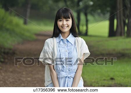 Young Woman in Forest View Large Photo Image Stock Photograph - Young Woman in Forest. Fotosearch