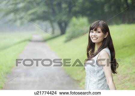 Picture - Young Woman in Park. Fotosearch