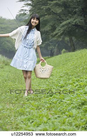 Young Woman in Park View Large Photo Image Stock Image - Young Woman in Park. Fotosearch