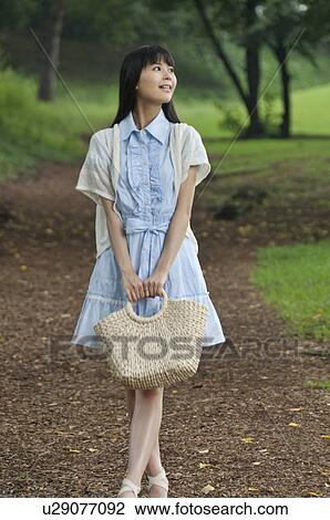 Young Woman in Park View Large Photo Image Stock Image - Young Woman in Park. Fotosearch