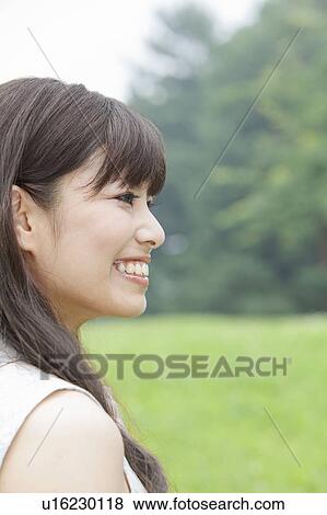 Young Woman in Park View Large Photo Image Stock Photo - Young Woman in Park. Fotosearch