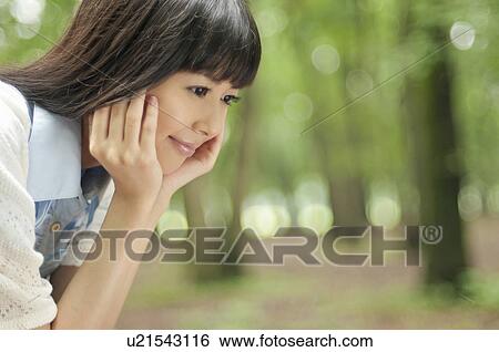 Young Woman Looking Down View Large Photo Image Stock Photograph - Young Woman Looking Down. Fotosearch