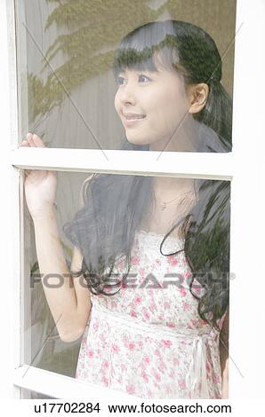 Young Woman Looking Through Window View Large Photo Image Picture - Young Woman Looking Through Window. Fotosearch