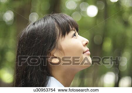 Picture - Young Woman Looking Up. Fotosearch
