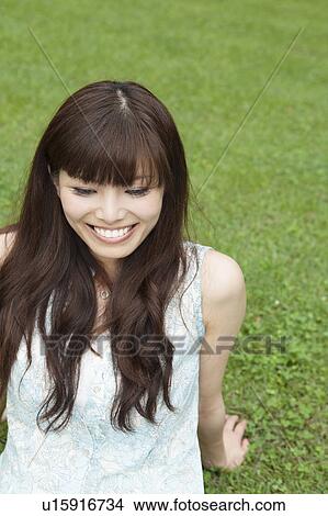 Young Woman on Grass View Large Photo Image Picture - Young Woman on Grass. Fotosearch