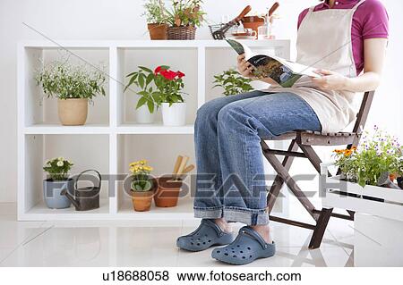 Young woman reading a book View Large Photo Image Stock Photo - Young woman reading a book. Fotosearch