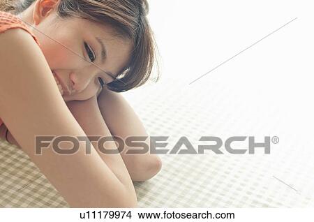 Young Woman Resting on Table View Large Photo Image Picture - Young Woman Resting on Table. Fotosearch