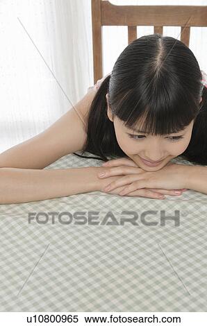 Young Woman Resting on Table View Large Photo Image Stock Photography - Young Woman Resting on Table. Fotosearch