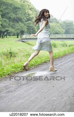 Young Woman Running on Country Road View Large Photo Image Stock Photo - Young Woman Running on Country Road. Fotosearch