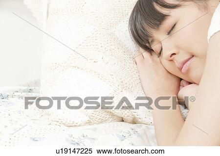 Stock Photography - Young Woman Sleeping. Fotosearch