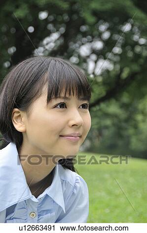 Stock Image - Young Woman Smiling. Fotosearch