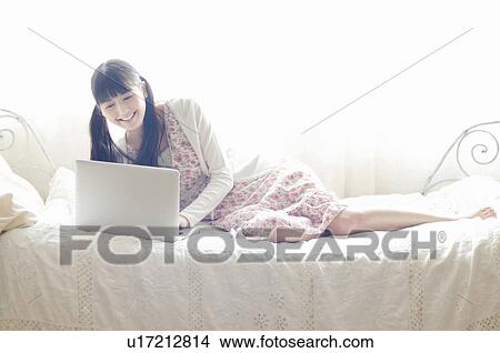 Picture - Young Woman Using Laptop. Fotosearch
