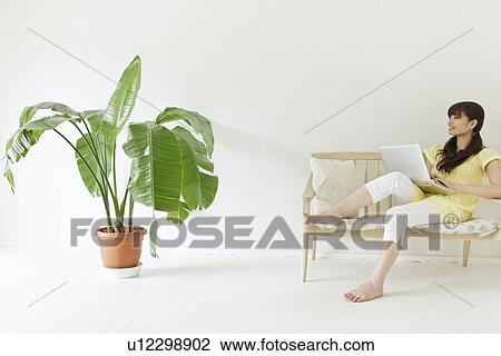 Stock Image - Young Woman Using Laptop. Fotosearch