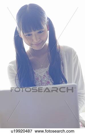 Young Woman Using Laptop View Large Photo Image Stock Photo - Young Woman Using Laptop. Fotosearch