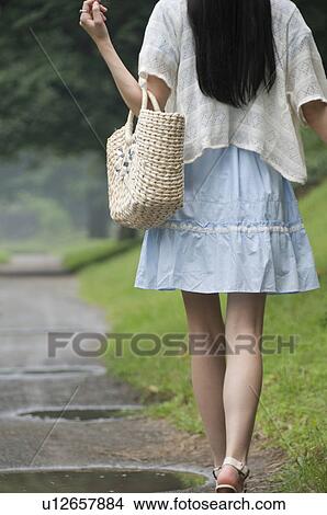 Young Woman Walking on Dirt Track View Large Photo Image Picture - Young Woman Walking on Dirt Track. Fotosearch