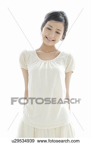 Stock Photo - Young Woman Wearing White Clothes. Fotosearch