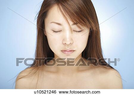 Young woman with eyes closed View Large Photo Image Stock Photograph - Young woman with eyes closed. Fotosearch