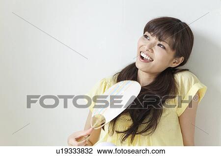 Young Woman with Fan View Large Photo Image Stock Image - Young Woman with Fan. Fotosearch