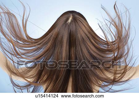 Young woman with hair flowing View Large Photo Image Picture - Young woman with hair flowing. Fotosearch