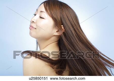 Young woman with hair flowing View Large Photo Image Stock Image - Young woman with hair flowing. Fotosearch