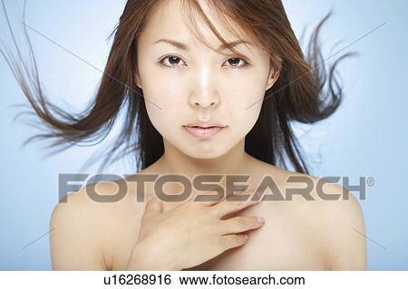 Young woman with hair flowing View Large Photo Image Stock Photograph - Young woman with hair flowing. Fotosearch