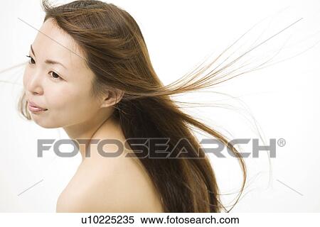 Young woman with hair flowing View Large Photo Image Stock Photography - Young woman with hair flowing. Fotosearch