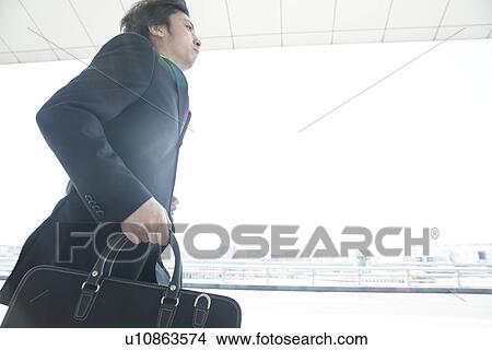 A Businessman running View Large Photo Image Picture - A Businessman running. Fotosearch