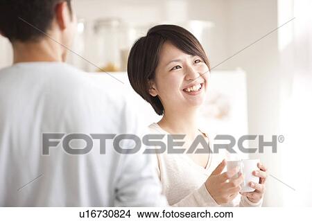 Picture - A couple talking. Fotosearch