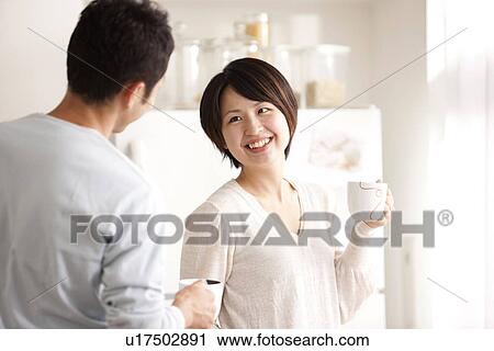 Stock Image - A couple talking. Fotosearch