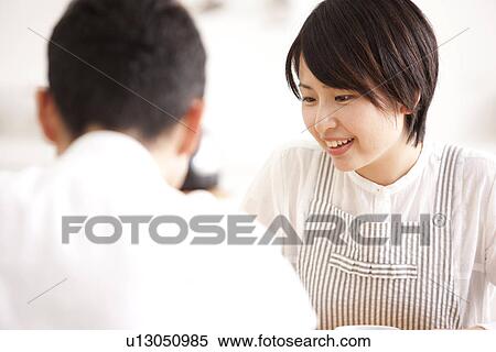Stock Photography - A couple talking. Fotosearch