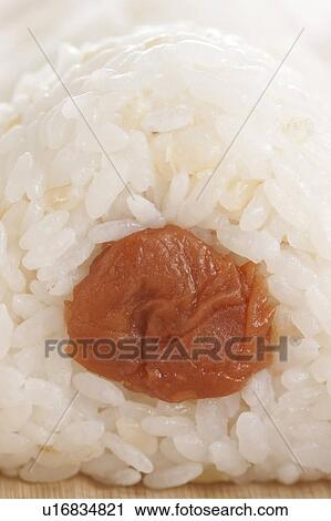 A rice ball with a Japanese Plum pickle View Large Photo Image Stock Image - A rice ball with a Japanese Plum pickle. Fotosearch