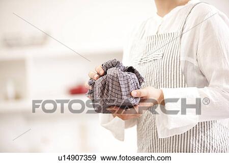A woman holding a lunch box wrapped View Large Photo Image Stock Photo - A woman holding a lunch box wrapped. Fotosearch