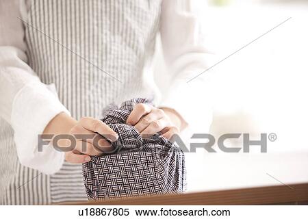 A woman wrapping a lunch box View Large Photo Image Stock Photography - A woman wrapping a lunch box. Fotosearch
