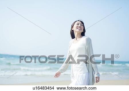 A young woman in the beach View Large Photo Image Picture - A young woman in the beach. Fotosearch
