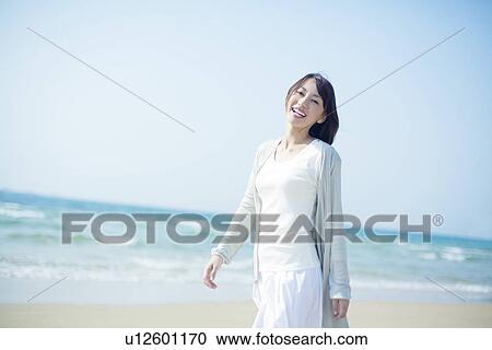 A young woman in the beach View Large Photo Image Stock Image - A young woman in the beach. Fotosearch
